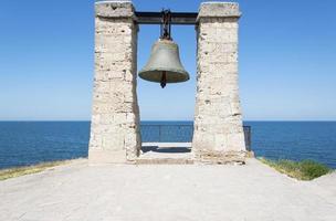 Large iron bell on the Black Sea coast in Chersonese photo