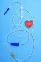 empty plastic dropper with needles and red heart photo