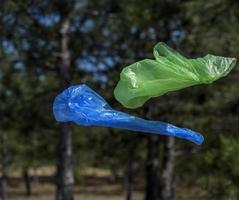 Two polyethylene bags for garbage fly in the air photo