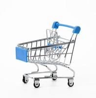 empty miniature metal shopping cart isolated on white background photo