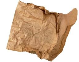 crumpled piece of brown paper isolated on white background photo