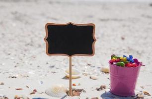 black wooden tablet and a pink baby bucket photo