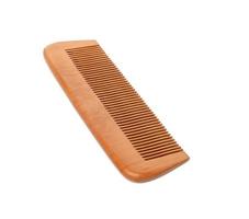 wooden brown hair comb isolated on white background photo