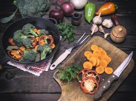 fresh pieces of carrots, broccoli and red pepper photo