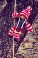 Rag doll hanging on a rope photo