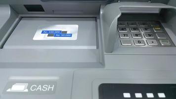 Close up of ATM keypad with withdrawal. ATM machine. photo