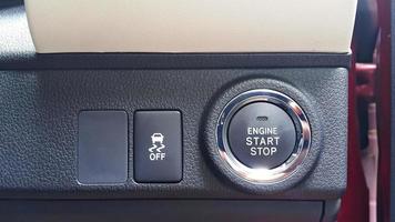 Close up view of engine start stop button and traction control button of the car photo