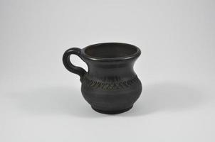 earthenware mug on a white background photo