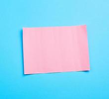 blue banner with pink paper sheet curly for paper design photo