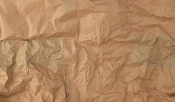 crumpled brown sheet of paper, full frame photo