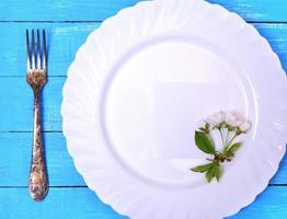 White plate with a paper sheet photo