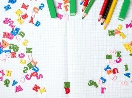 blank white sheet of squared papers and school supplies, back to school photo