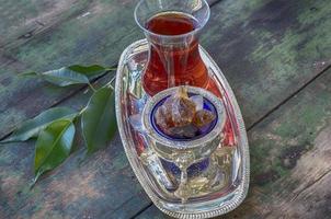 Black tea Turkish glass on a silver platter photo