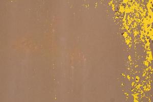 Yellow steel plate, rough surface, peeling paint, showing rusty steel texture. abstract background. photo