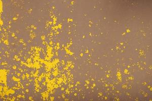 Yellow steel plate, rough surface, peeling paint, showing rusty steel texture. abstract background. photo