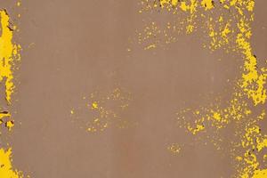 Yellow steel plate, rough surface, peeling paint, showing rusty steel texture. abstract background. photo