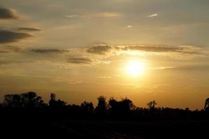 background of the setting sun in the evening photo