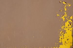 Yellow steel plate, rough surface, peeling paint, showing rusty steel texture. abstract background. photo