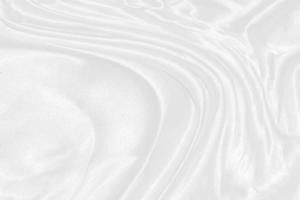 Texture, background, pattern. White cloth background abstract with soft waves, great for dresses or suits, where transparency and flow are required photo