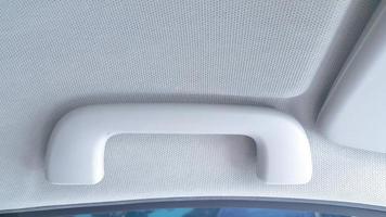 Close up of car handrail. Hand grip in car for safety photo