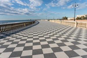 Livorno,Italy-november  27, 2022-view of the Mascagni terrace, a splendid belvedere terrace with checkerboard paved surface, Livorno, Tuscany, Italy during a sunny day. photo