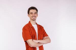 Portrait of young handsome man standing with crossed arms with isolated on studio white background photo