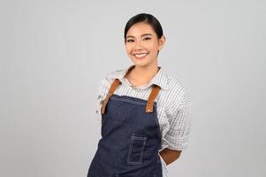 Portrait Asian young woman smile with happy in waitress unifrom photo