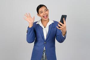 Young beautiful woman in formal clothing for officer use smartphone posture photo