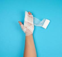 arm wrapped with white gauze bandage photo