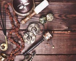 Tibetan singing bowl and other religious ritual instruments for meditation photo
