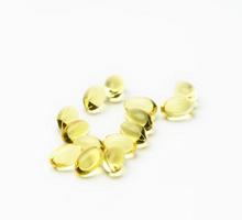 fish oil capsules on white background, food supplement for health photo