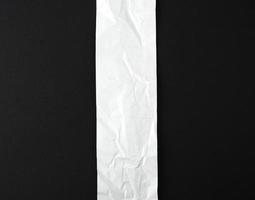 blank strip of paper on a black background photo