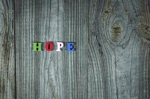 Words of hope from small multi-colored wooden letters photo