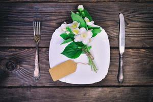 White plate and metal cutlery photo