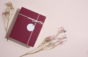 Rectangular gift cardboard box on beige background, top view photo