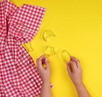 various iron baking dishes of cookies in female hands photo