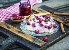 piece of cottage cheese cake and cherry berries photo