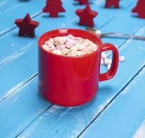 hot chocolate with marshmallow in a red ceramic mug photo