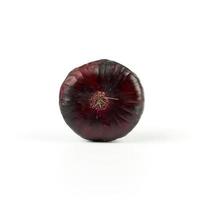 round purple onion in husk isolated on white background photo