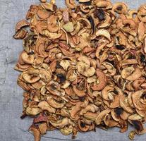 dry apple slices on a gray linen napkin photo