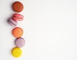 stack of colorful baked macaron almond flour on a white background photo