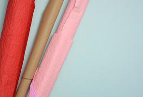 decorative wrapping paper in a roll on a blue background photo