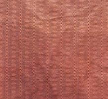 fragment of old brown textile carpet for floor photo