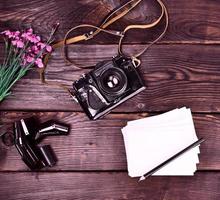 Old vintage film camera in a leather case photo