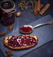 bread smeared with raspberry jam photo