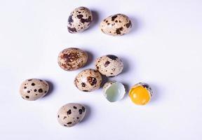 Quail eggs on a white surface photo