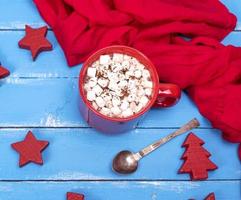 hot chocolate with marshmallows in a red ceramic mug photo