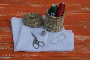 Fabric with objects for sewing and embroidery, orange tone photo