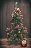 christmas tree on a wooden background photo