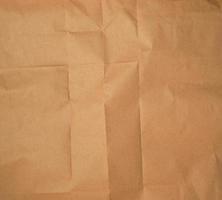 crumpled brown sheet of paper, full frame photo